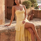 Elsie spaghetti strap sweetheart maxi dress with a structured corset bodice, delicate spaghetti straps, sheer panel detailing, an asymmetric three-tier chiffon skirt with ruffle hem, front slit, and a flowing high-low silhouette, perfect for weddings and special occasions.