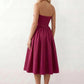 Women's strapless corset midi dress with a structured sweetheart neckline, boned bodice, pintuck basque waist and full pleated A-line skirt, elegant wedding guest and occasion dress.