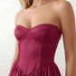 Women's strapless corset midi dress with a structured sweetheart neckline, boned bodice, pintuck basque waist and full pleated A-line skirt, elegant wedding guest and occasion dress.