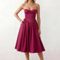 Women's strapless corset midi dress with a structured sweetheart neckline, boned bodice, pintuck basque waist and full pleated A-line skirt, elegant wedding guest and occasion dress.