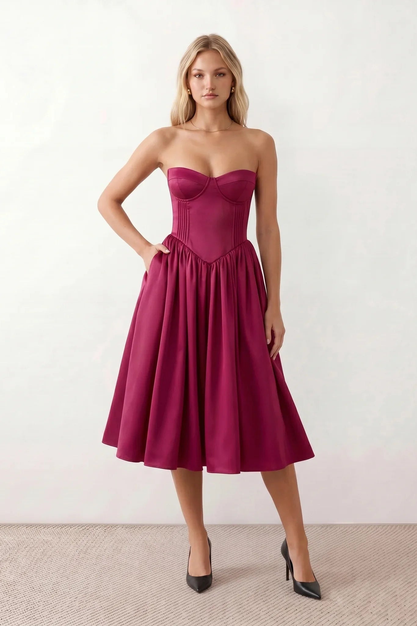 Women's strapless corset midi dress with a structured sweetheart neckline, boned bodice, pintuck basque waist and full pleated A-line skirt, elegant wedding guest and occasion dress.