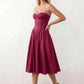 Women's strapless corset midi dress with a structured sweetheart neckline, boned bodice, pintuck basque waist and full pleated A-line skirt, elegant wedding guest and occasion dress.