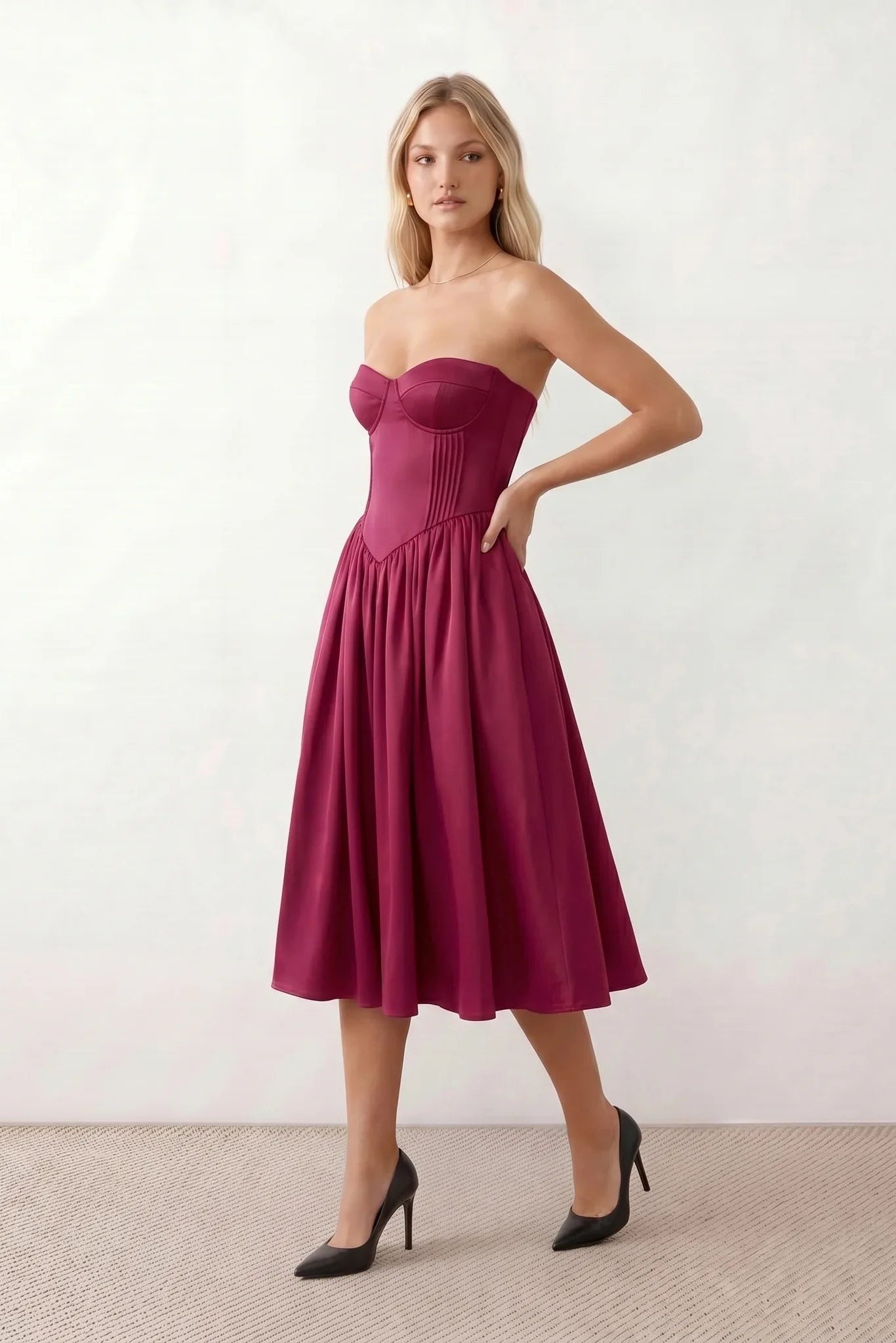 Women's strapless corset midi dress with a structured sweetheart neckline, boned bodice, pintuck basque waist and full pleated A-line skirt, elegant wedding guest and occasion dress.