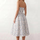 Women's strapless corset midi dress with a structured sweetheart neckline, boned bodice, pintuck basque waist and full pleated A-line skirt, elegant wedding guest and occasion dress.