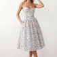 Women's strapless corset midi dress with a structured sweetheart neckline, boned bodice, pintuck basque waist and full pleated A-line skirt, elegant wedding guest and occasion dress.