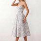 Women's strapless corset midi dress with a structured sweetheart neckline, boned bodice, pintuck basque waist and full pleated A-line skirt, elegant wedding guest and occasion dress.