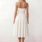 Women's strapless corset midi dress with a structured sweetheart neckline, boned bodice, pintuck basque waist and full pleated A-line skirt, elegant wedding guest and occasion dress.