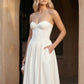 Women's strapless corset midi dress with a structured sweetheart neckline, boned bodice, pintuck basque waist and full pleated A-line skirt, elegant wedding guest and occasion dress.