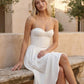 Women's strapless corset midi dress with a structured sweetheart neckline, boned bodice, pintuck basque waist and full pleated A-line skirt, elegant wedding guest and occasion dress.