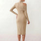 Woman wearing the Asymmetric Neck Open Back Midi Dress featuring an asymmetric mock-neck halter, off-shoulder ruched detailing, long fitted sleeves, an elegant open back, fitted midi silhouette and front slit, styled for weddings, cocktail parties and formal occasions.