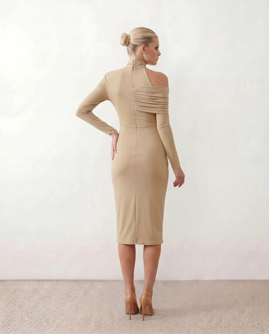 Woman wearing the Felisa Asymmetric Neck Open Back Midi Dress featuring an asymmetric mock-neck halter, off-shoulder ruched detailing, long fitted sleeves, an elegant open back, fitted midi silhouette and front slit, styled for weddings, cocktail parties and formal occasions.