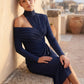 Woman wearing the Asymmetric Neck Open Back Midi Dress featuring an asymmetric mock-neck halter, off-shoulder ruched detailing, long fitted sleeves, an elegant open back, fitted midi silhouette and front slit, styled for weddings, cocktail parties and formal occasions.