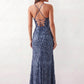 Women's Sequined Spaghetti Strap Maxi Dress in a full-length trumpet silhouette with all-over shimmering sequins, square neckline, delicate spaghetti straps, adjustable lace-up back, and elegant front slit, designed for weddings, proms, black-tie events, and formal evening occasions.
