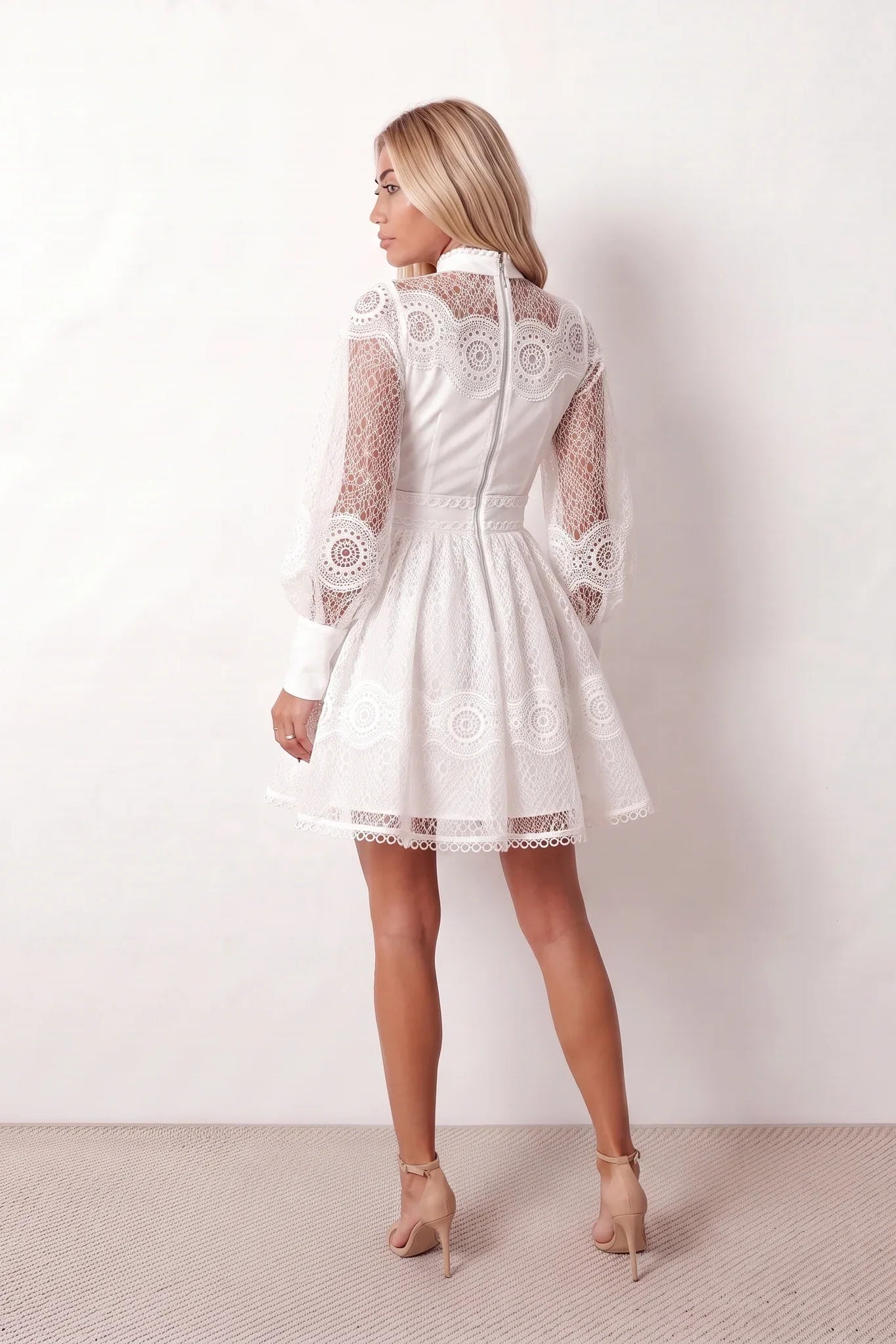 Woman wearing the Lace Openwork Mini Dress featuring intricate lace-inspired openwork, a mandarin collar, decorative front buttons, long sleeves, a fitted waist, and a scalloped mini hem, ideal for weddings, cocktail parties, and elegant occasions.