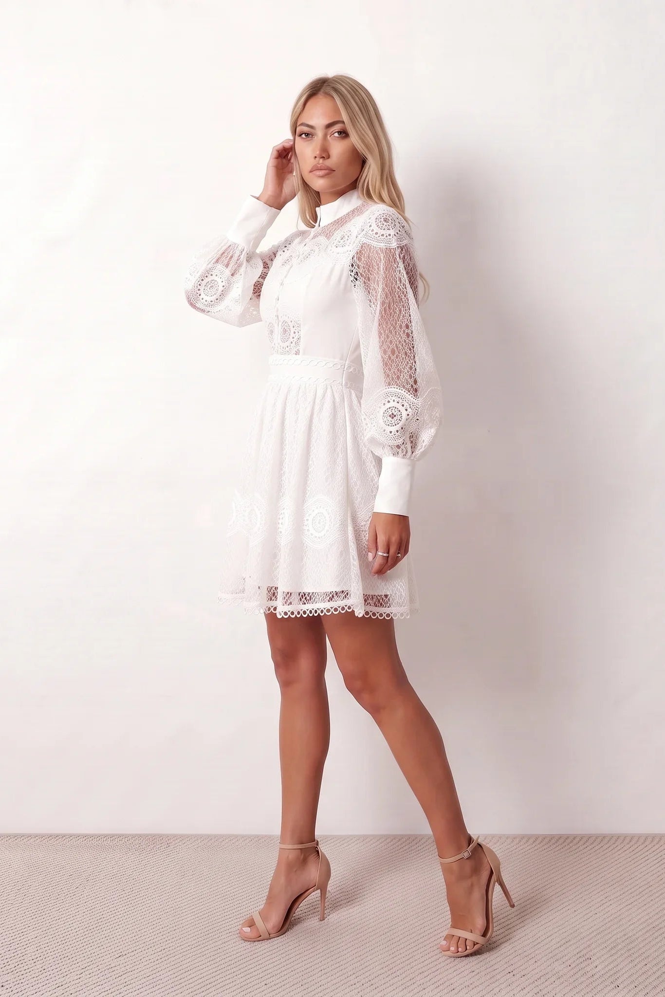 Woman wearing the Openwork Mini Dress featuring intricate lace-inspired openwork, a mandarin collar, decorative front buttons, long sleeves, a fitted waist, and a scalloped mini hem, ideal for weddings, cocktail parties, and elegant occasions.