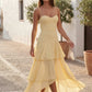 Elsie spaghetti strap sweetheart maxi dress with a structured corset bodice, delicate spaghetti straps, sheer panel detailing, an asymmetric three-tier chiffon skirt with ruffle hem, front slit, and a flowing high-low silhouette, perfect for weddings and special occasions.