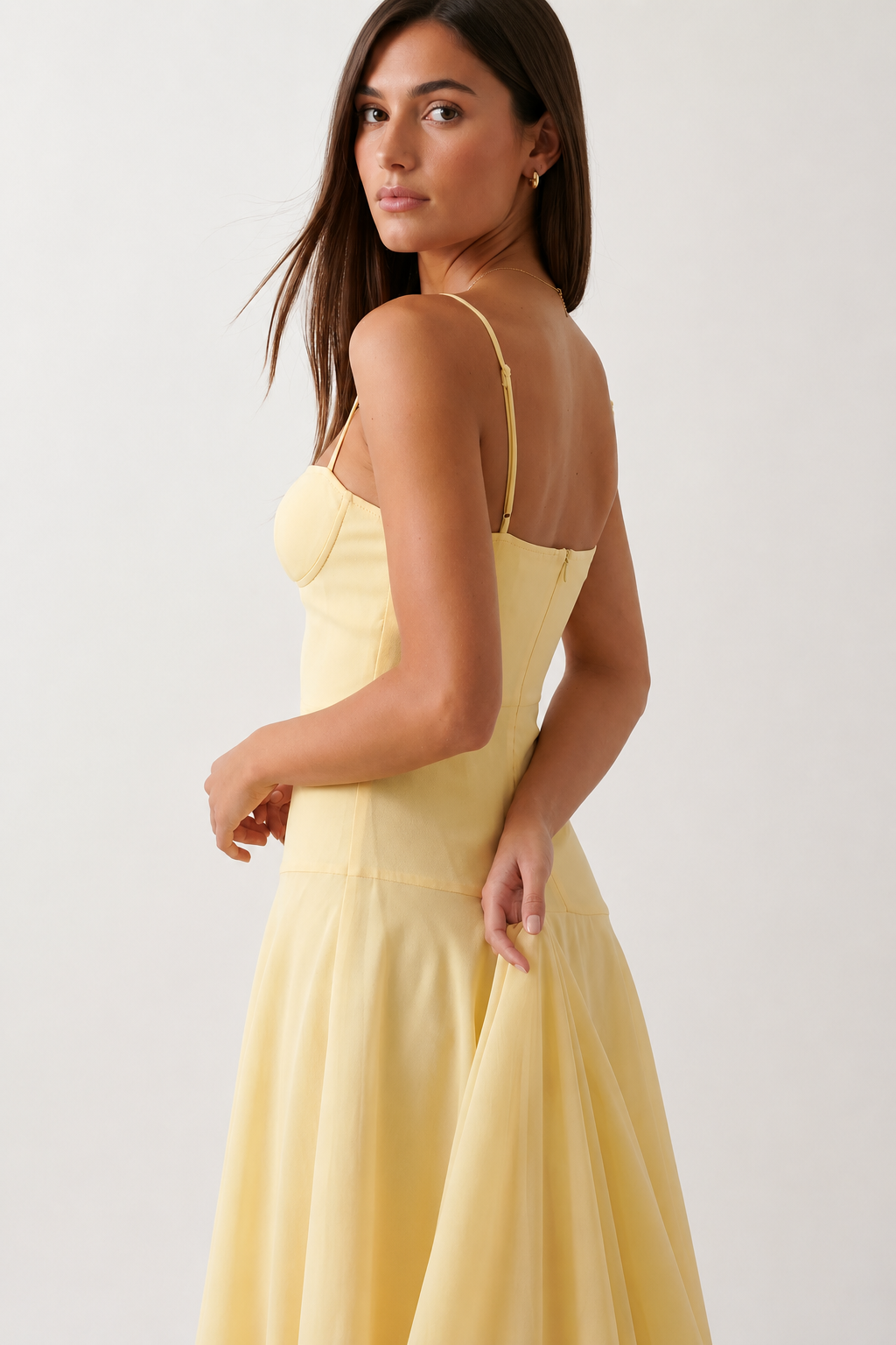 Elsie spaghetti strap sweetheart maxi dress with a structured corset bodice, delicate spaghetti straps, sheer panel detailing, an asymmetric three-tier chiffon skirt with ruffle hem, front slit, and a flowing high-low silhouette, perfect for weddings and special occasions.