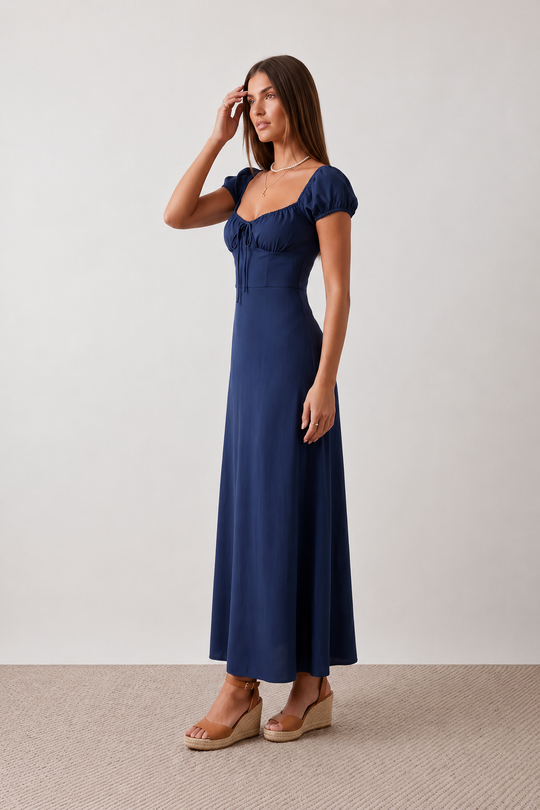Halle sweetheart low back maxi dress with a structured corset bodice, tie-front bust detail, sweetheart neckline, low open back, and flowing A-line maxi skirt with a floor-length hem.