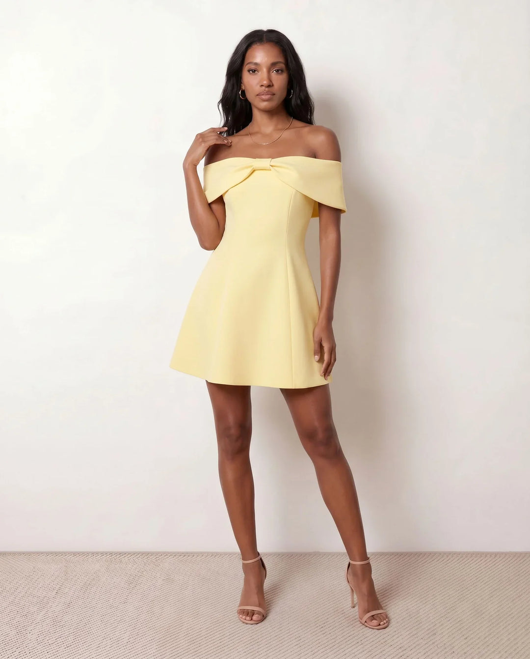 Leni strapless off-shoulder mini dress featuring a Bardot foldover neckline, centered bow detail, twist-front bodice with princess seam shaping, and a flared A-line mini skirt for cocktail parties, weddings, and special occasions.