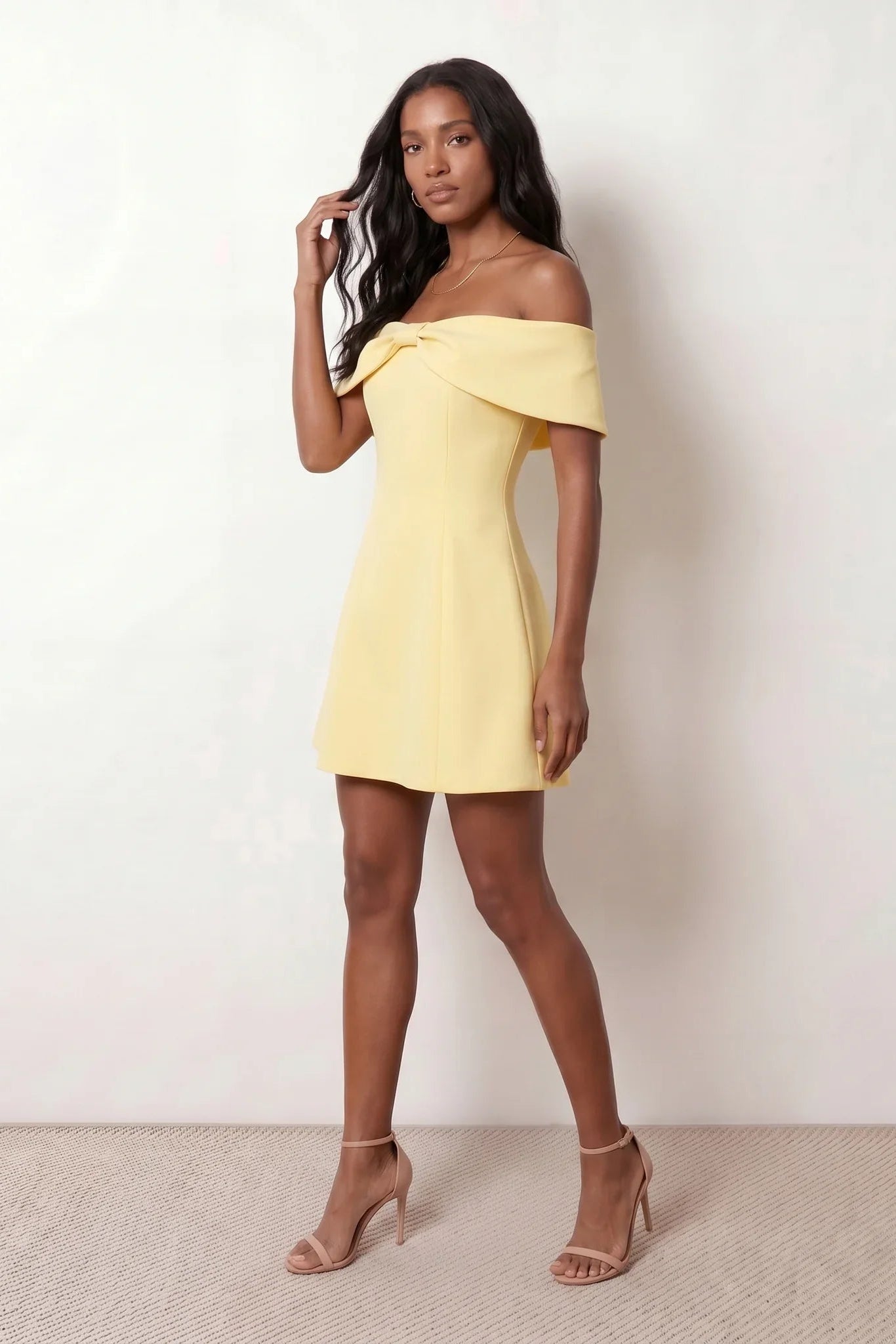 Leni strapless off-shoulder mini dress featuring a Bardot foldover neckline, centered bow detail, twist-front bodice with princess seam shaping, and a flared A-line mini skirt for cocktail parties, weddings, and special occasions.