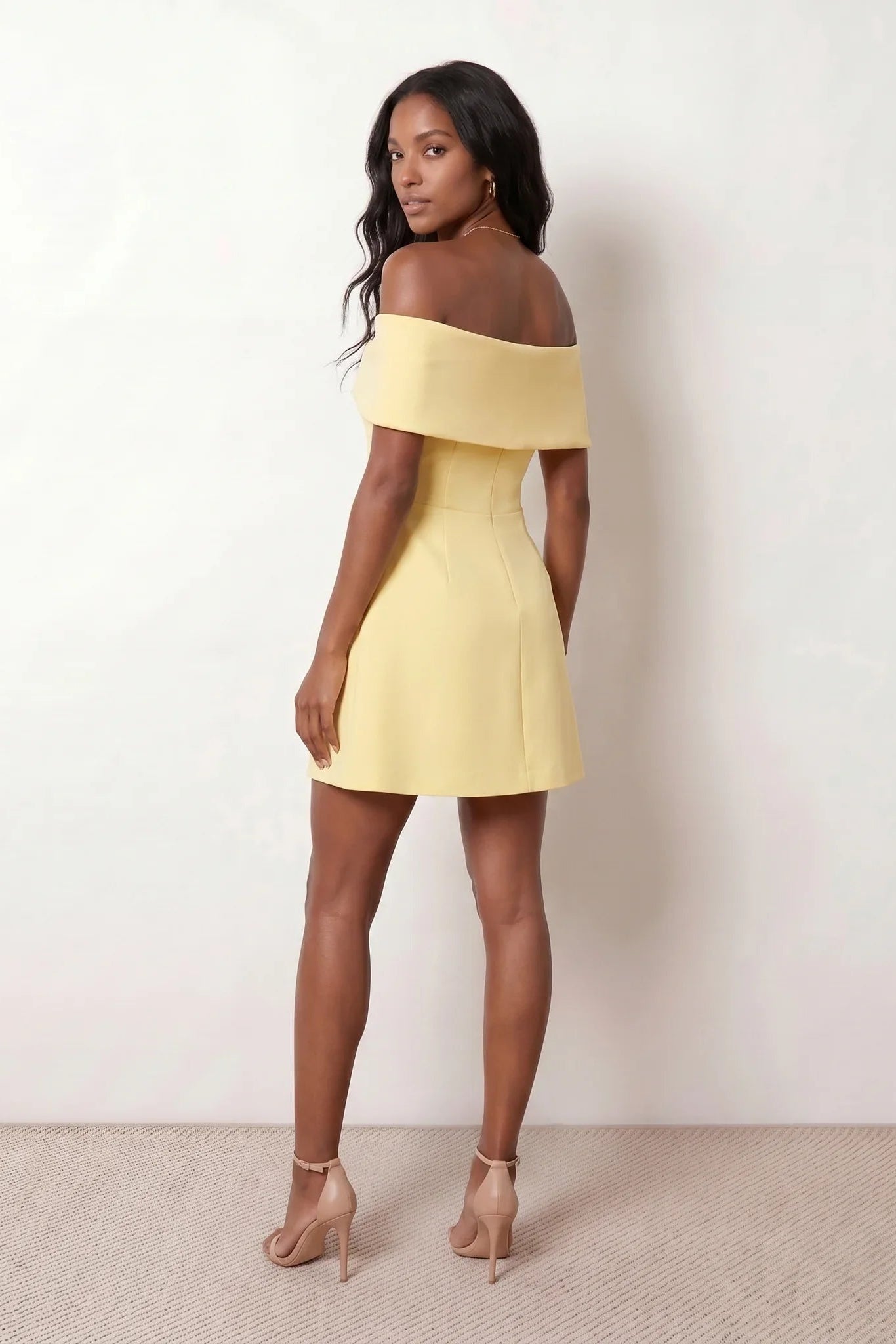 Leni strapless off-shoulder mini dress featuring a Bardot foldover neckline, centered bow detail, twist-front bodice with princess seam shaping, and a flared A-line mini skirt for cocktail parties, weddings, and special occasions.