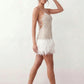 Mariela sequined spaghetti strap mini dress with a sheer sequined bodice, open low back featuring beaded cage straps, layered ostrich feather trim, and a straight-cut mini silhouette for cocktail parties and evening events.