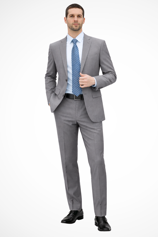 Man wearing a gray suit with a blue tie on a white background
