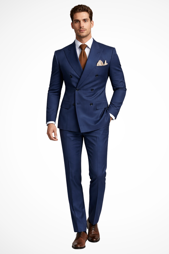 Man wearing a blue suit with a white shirt and brown shoes on a white background