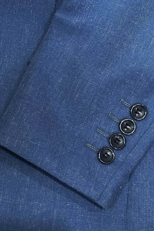 Close-up of a blue suit jacket with buttons