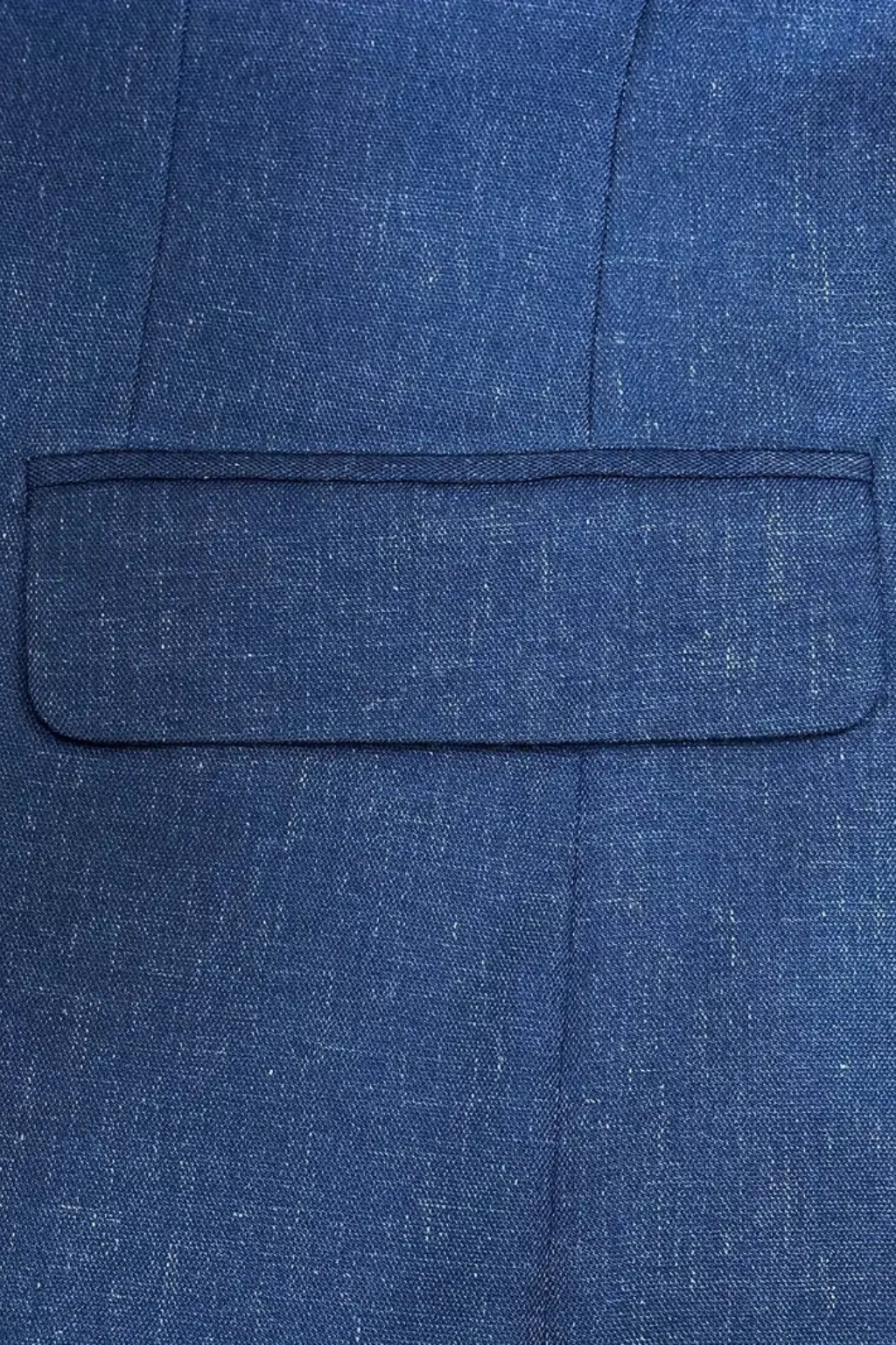 Close-up of a blue textured fabric with a pocket