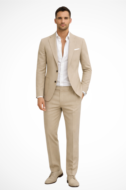 Man wearing a beige suit with a white shirt on a white background