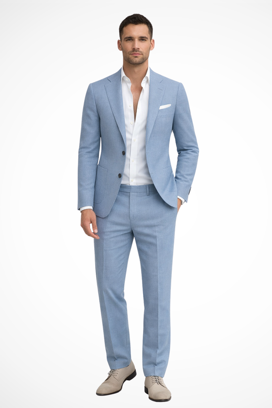 Man wearing a light blue suit with a white shirt on a white background