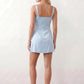 Women's Anahi lace slip mini dress featuring a sweetheart neckline, floral lace bustier with adjustable centre tie, low back, wide shoulder straps, and a satin-look A-line mini skirt, ideal for weddings, parties, and evening occasions.