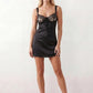 Women's Anahi lace slip mini dress featuring a sweetheart neckline, floral lace bustier with adjustable centre tie, low back, wide shoulder straps, and a satin-look A-line mini skirt, ideal for weddings, parties, and evening occasions.