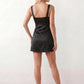 Women's Anahi lace slip mini dress featuring a sweetheart neckline, floral lace bustier with adjustable centre tie, low back, wide shoulder straps, and a satin-look A-line mini skirt, ideal for weddings, parties, and evening occasions.