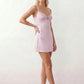 Women's Anahi lace slip mini dress featuring a sweetheart neckline, floral lace bustier with adjustable centre tie, low back, wide shoulder straps, and a satin-look A-line mini skirt, ideal for weddings, parties, and evening occasions.