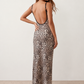 Women's Anika leopard print spaghetti strap low back maxi dress with a slim sheath silhouette, round neckline, adjustable straps and a floor-length straight hem.