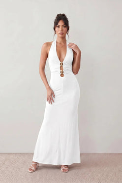 Woman wearing the Ariadna Mermaid Halter Maxi Dress featuring a deep plunge halter neckline, open back with adjustable tie fastening, gold-tone hardware at the ruched waist, subtle waist cut-out and a floor-length mermaid silhouette, ideal for weddings, black-tie events and formal evening occasions.
