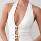 Woman wearing the Ariadna Mermaid Halter Maxi Dress featuring a deep plunge halter neckline, open back with adjustable tie fastening, gold-tone hardware at the ruched waist, subtle waist cut-out and a floor-length mermaid silhouette, ideal for weddings, black-tie events and formal evening occasions.