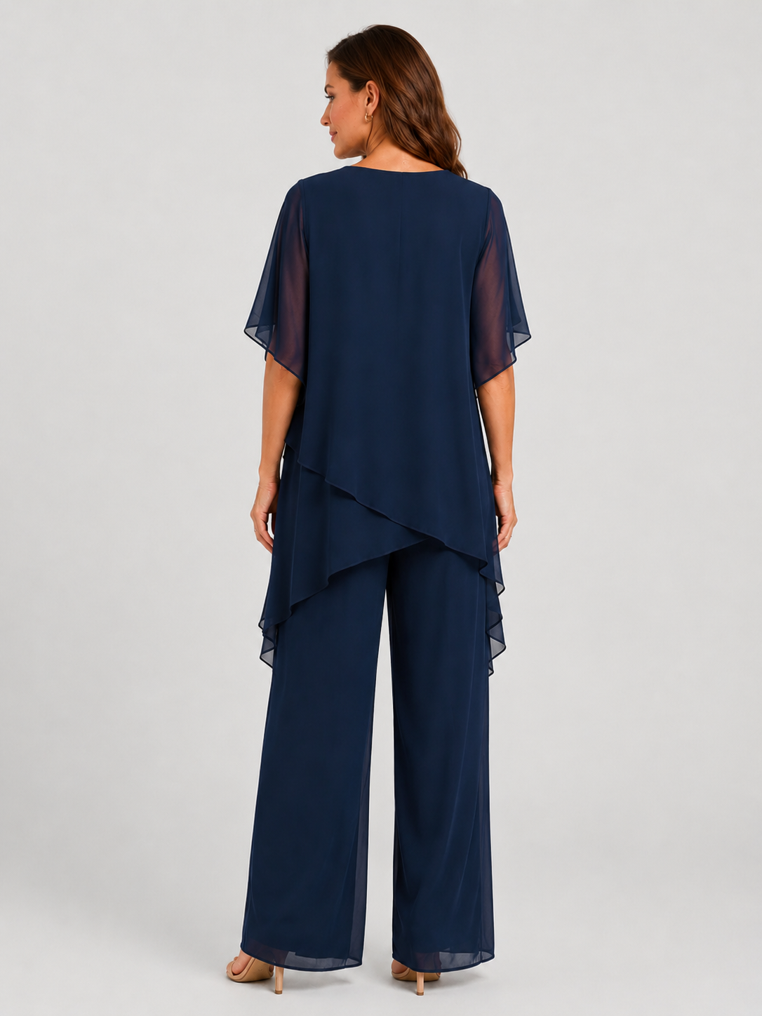 Women's chiffon-style two-piece set featuring an asymmetrical layered top and flowing wide-leg trousers in a relaxed elegant silhouette.