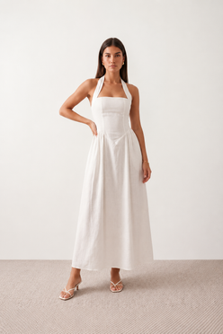 Aurora basque waist halter maxi dress with a halter neckline, open back, defined basque waist, and flowing A-line skirt in smooth fabric, ideal for weddings, formal events, and evening occasions.