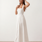 Aurora basque waist halter maxi dress with a halter neckline, open back, defined basque waist, and flowing A-line skirt in smooth fabric, ideal for weddings, formal events, and evening occasions.