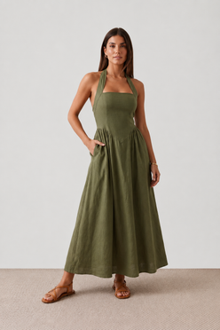 Aurora basque waist halter maxi dress with a halter neckline, open back, defined basque waist, and flowing A-line skirt in smooth fabric, ideal for weddings, formal events, and evening occasions.