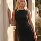 Maraea fitted sleeveless mini dress with a boat neckline, structured sheath silhouette, smooth finish, straight mini hem, and center back zip closure.