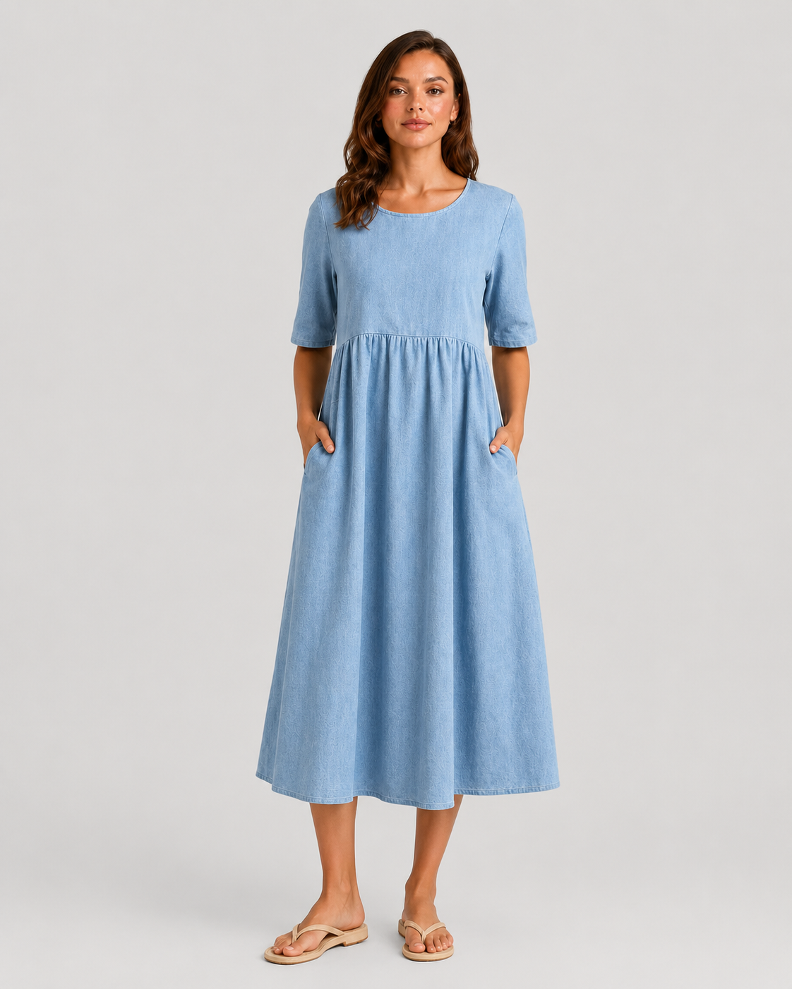 Woman wearing a relaxed-fit linen blend midi dress with a soft drape and breathable fabric, styled for effortless daytime elegance.