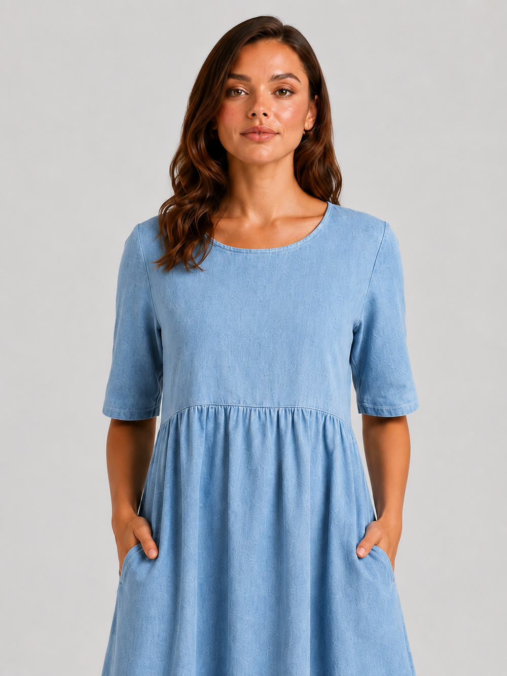Woman wearing a relaxed-fit linen blend midi dress with a soft drape and breathable fabric, styled for effortless daytime elegance.