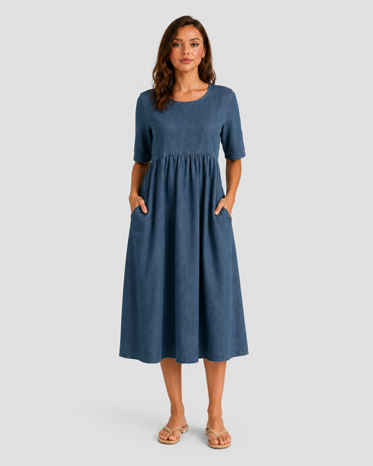 Woman wearing a relaxed-fit linen blend midi dress with a soft drape and breathable fabric, styled for effortless daytime elegance.