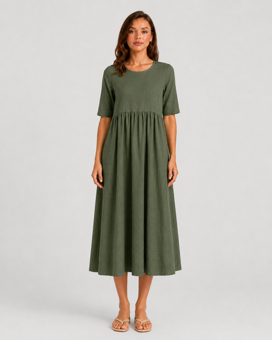 Woman wearing a relaxed-fit linen blend midi dress with a soft drape and breathable fabric, styled for effortless daytime elegance.