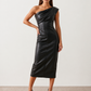 Woman wearing the Celia Faux Leather Glossy Midi Dress in high-shine faux leather, featuring an asymmetric off-the-shoulder draped neckline, fitted pencil silhouette, ruched waist, low-back design with concealed zip fastening, back slit, and elegant midi length, styled for cocktail parties and evening occasions.