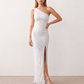 Women's Christa sequined asymmetric neck maxi dress with all-over shimmering sequins, elegant one-shoulder neckline, low open back, fitted silhouette and front thigh split, ideal for weddings, black-tie events, galas and formal evening occasions.